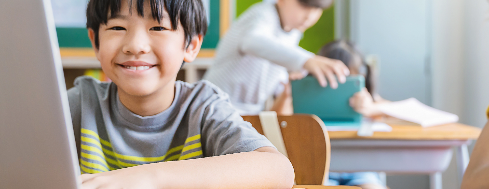 A Young Child Using A Laptop