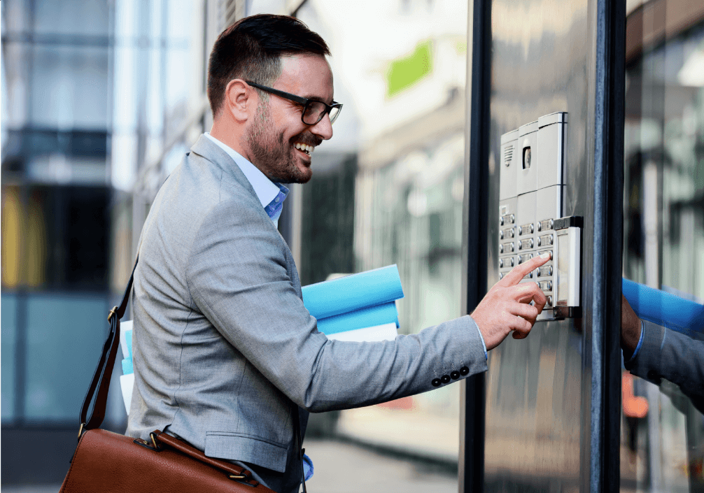 Man In Suit Entering Apartment Building