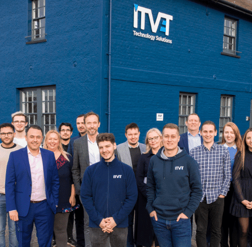 The ITVET team standing outside head office.l