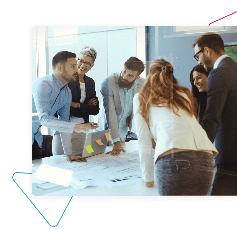 people standing around desk